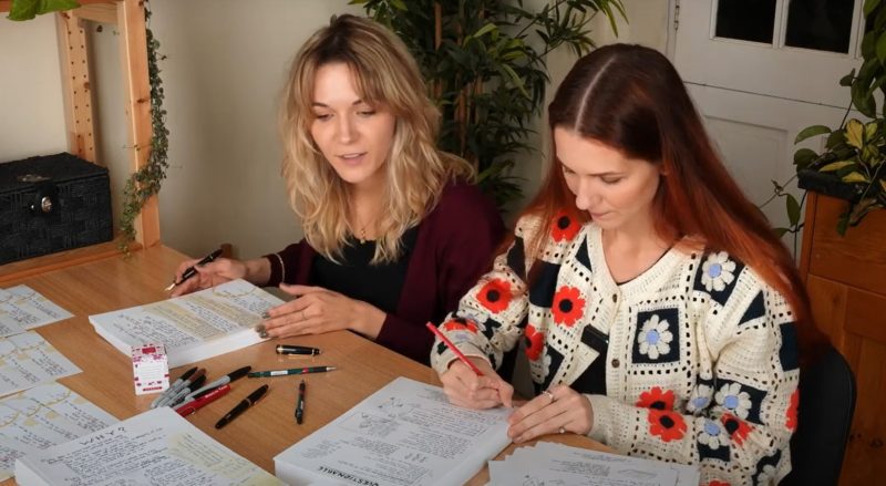 Mona and Lisa signing Limited Edition Lyric Prints
